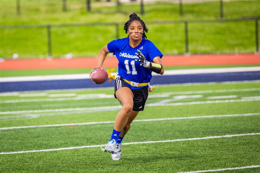 Students play flag football